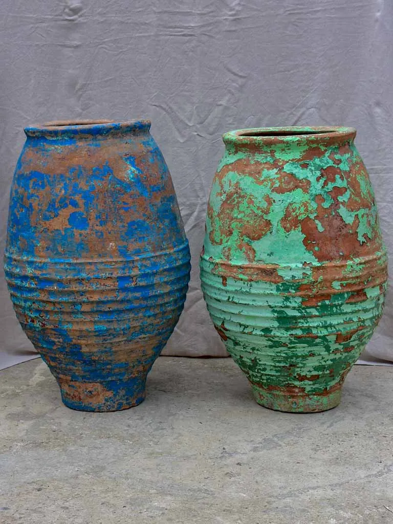 Two very large antique Spanish olive oil jars - blue and green